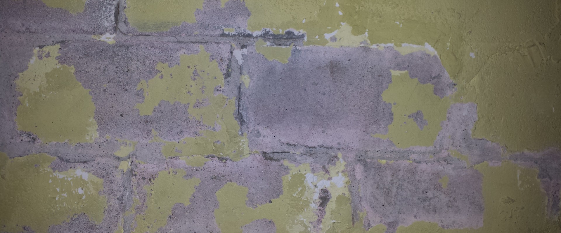 How do you repair a damaged cinder block wall?