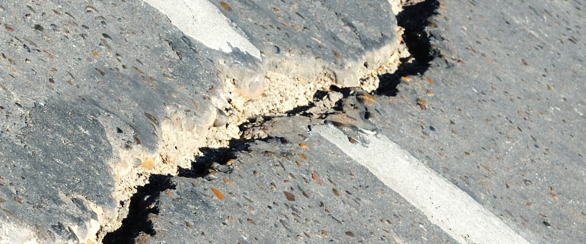 How do you get rid of cracks in a concrete driveway?